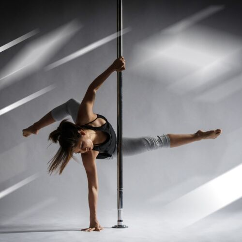 Woman dancing a lyrical pole dance choreography